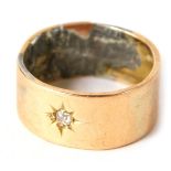 A wedding band, set with illusion tiny diamond in star setting, crudely soldered and covering marks,