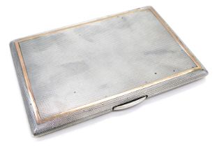 A George VI silver cigarette case, yellow gold banded engine turn design, with gilt interior, London