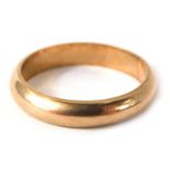 A rose gold wedding band, of plain design, yellow metal stamped 9ct, ring size T½, 5.1g all in.