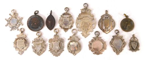 A quantity of silver athletic's and other award fobs, each engraved to reverse, weighable silver 3.0