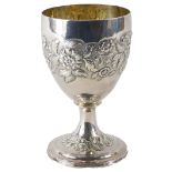 A George III silver cup or challis, embossed with flowers, a vacant cartouche, etc., London 1802, 7.