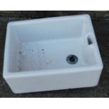 A cream glazed rectangular Belfast sink, 59cm x 45cm.