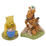 A Royal Doulton Winnie The Pooh figure of Nurse Tigger, and a figure of Winnie The Pooh 'All the Flo