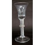 A 19thC wine glass, with waisted bell shaped bowl, air twist stem with collar, on a folded foot, 16c
