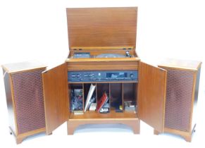 A Dynatron MC1320PM music centre, with tape deck, record deck, etc., in mahogany case with a pair of