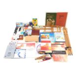 A large quantity of artists materials, to include paper, books, easels, etc.