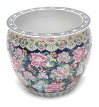 A 20thC Chinese porcelain fish bowl or jardiniere, decorated overall with flowers on a blue ground,