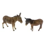 Two Beswick models of donkeys.