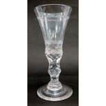 A 19thC wine glass, with bell shaped bowl and elaborate facet cut stem and engraved domed foot.