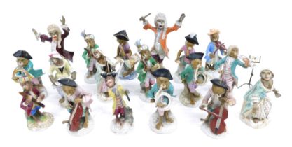 A collection of monkey band figures, to include Meissen conductor, figure of a singer, a lady seated