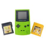 A lime green Nintendo Game Boy Colour, and two games comprising Ronaldo's v Football, and Pokeman Ye