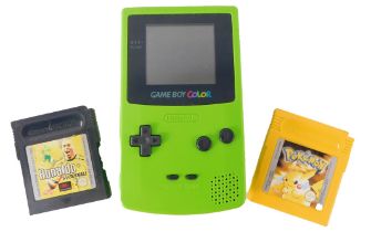 A lime green Nintendo Game Boy Colour, and two games comprising Ronaldo's v Football, and Pokeman Ye