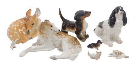 A collection of Russian USSR porcelain dogs, to include Bortzoi, Spaniel, Dachshund and a recumbent