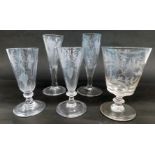 Four various 19thC ale flutes, and a rummer carved with monogram leaves, etc.