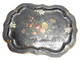 A Victorian papier mache tray, painted with flowers and inlaid with mother of pearl on a black groun