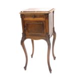 A French rosewood bedside pot cupboard, the rouge marble top above frieze drawer, and a drawer enclo