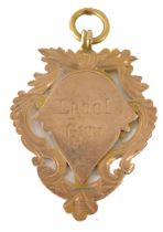 A 9ct gold swimming fob, engraved Liverpool Gym Swimming, with cartouche design, 4.3g.