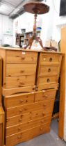 Two pine three drawer bedsides, piecrust table, and a pine chest of two short and four long drawers.