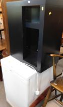 A Bosch Exxcel Max Freedom Performance fridge, and a black finish side table.