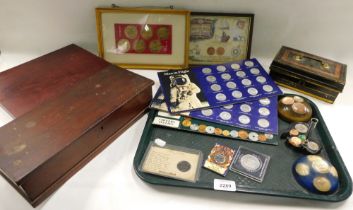 A group of collectors coin packs, framed space collectors coins, coin paperweights, collectors crown