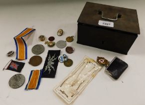 Various military badges, coronation and George V medallions, etc. enclosed in a steel tin.