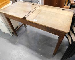 A pine double child's school desk.