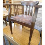 An oak smoker's bow chair, with leather drop in seat.