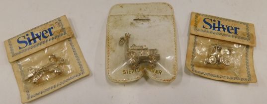 Three novelty charms, comprising Stephenson's Rocket, racing car, and train, each in pouch marked st