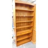 A Parker Knoll teak finish bookcase, 93cm high, 87cm wide and 27cm deep.