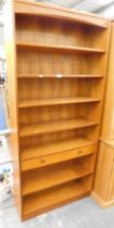 A Parker Knoll teak finish bookcase, 93cm high, 87cm wide and 27cm deep.