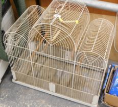 A cream metal bird cage.