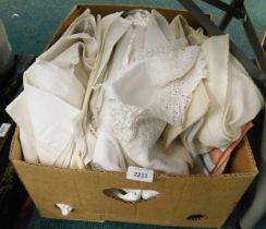 A quantity of linen and lace tablecloths.