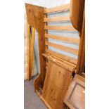 A pine single bed frame with slats.