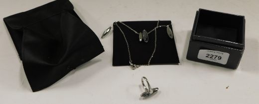 A Calvin Klein jewellery suite, comprising necklace, drop earrings and dress ring, each set in stain