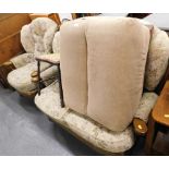A sofa suite, in the Cottage style, comprising two seater sofa, matching armchair, brown footstool,