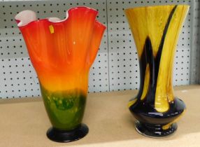 Two Art glass vases, comprising an orange and green flared rimmed bowl, and a brown and yellow vase.