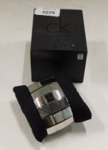 A Calvin Klein stainless steel ladies wristwatch, model K40211, with silvered finish, three row box