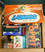 A box of toys and games, to include Sorry, Coppit, Origami set, travel Scrabble, Triominoes, Masterm