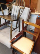 A mahogany framed easy chair, an Ercol elbow chair and a bedroom chair. (3)