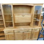 A Jentique pine finish display cabinet.