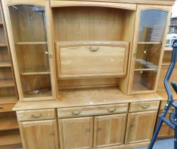 A Jentique pine finish display cabinet.