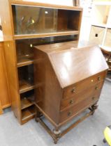 An oak bureau, and a four tier bookcase.