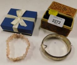 A Victorian silver hinged bangle, and a cultured pearl bracelet. (2)