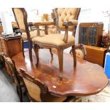 An Italian marquetry inlaid dining table, and six cabriole backed chairs. The upholstery in this lo