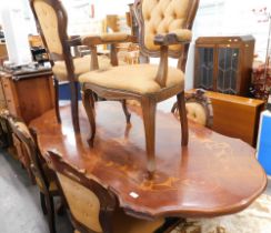 An Italian marquetry inlaid dining table, and six cabriole backed chairs. The upholstery in this lo