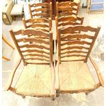 A set of six ladder back and rush seated late 19thC dining chairs.