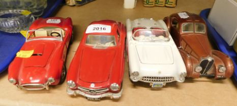 Four model Burago cars, comprising Bugatti Atlantic 1936, Chevrolet Corvette 1957, Mercedes Benz 300