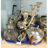 Silver plated wares, comprising a three branch candelabra, a plated coffee pot with brown ebonised h