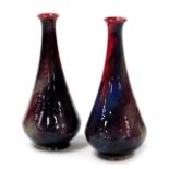 A pair of Royal Doulton Sung flambe vases, designed by Fred Moore, of tapering outswept form, printe