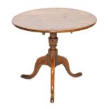 A George III oak occasional table, cut down, the circular top raised on a partially turned column ov